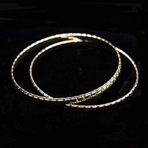 TWO GOLD TONE BANGLES WITH ROW OF SQUARES DESIGN - JBBTDG1